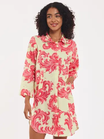 Gabriella Cotton Baroque Swirl Dress – Organic cotton, baroque swirl pattern in pistachio and pink, with collar, pockets, and side slit.