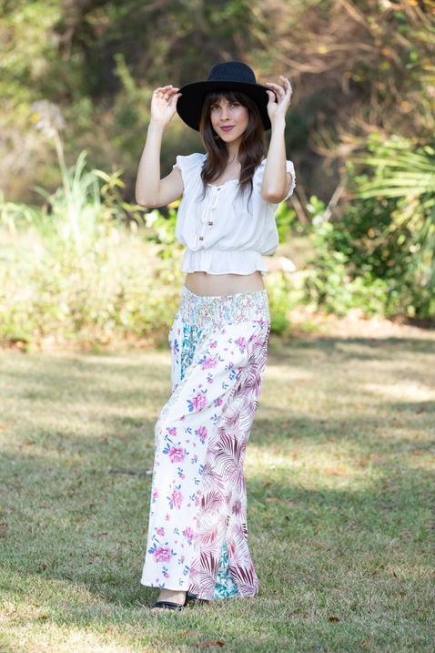 Woman wearing boho floral patchwork palazzo pants made of rayon